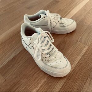 Nike All-White Low-Top Sneakers with Perforated Details